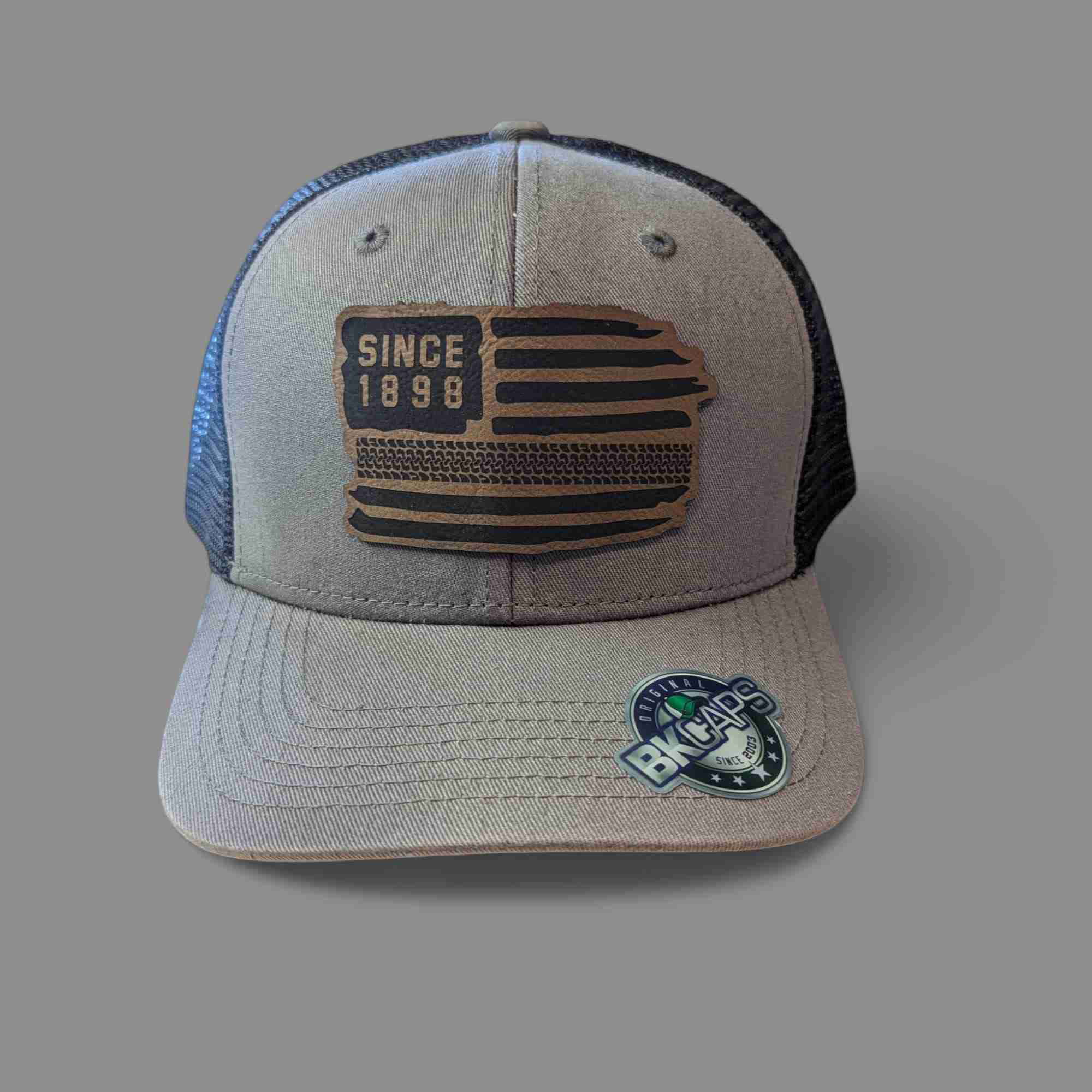 Vintage "Since 1898" Leather Patch Trucker Hat – American Flag Edition Cover image
